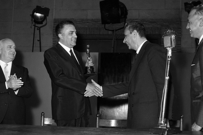 Aldo Moro delivers the Academy Award to Fellini for 8 and 1/2